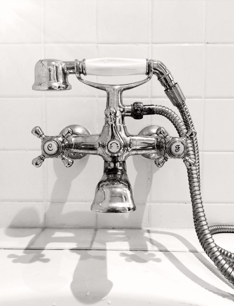 Chrome Dual Faucet on Ceramic Surface